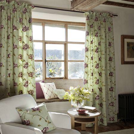 Linen curtains in a cottage from Clarke and Clarke's Tatton Linens fabric collection